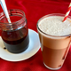 Jar of chocolate syrup; Glass of egg cream